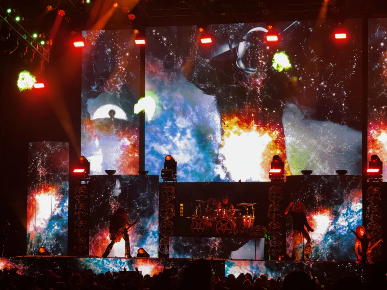 Rob Zombie stage production with flames and a large face projected behind the band.